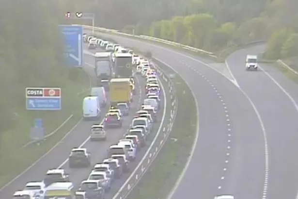 All traffic being held at bridge after vehicle overturns - live updates