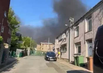 Residents told to keep windows and doors closed as smoke billows above town