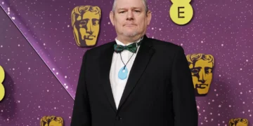 ‘I Swear’ subject John Davidson “deeply mortified” by Tourette’s N-word outburst at BAFTAs
