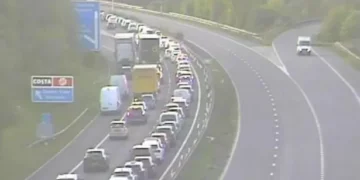 All traffic being held at bridge after vehicle overturns – live updates