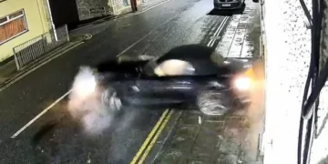 Car spins out of control and collides with house